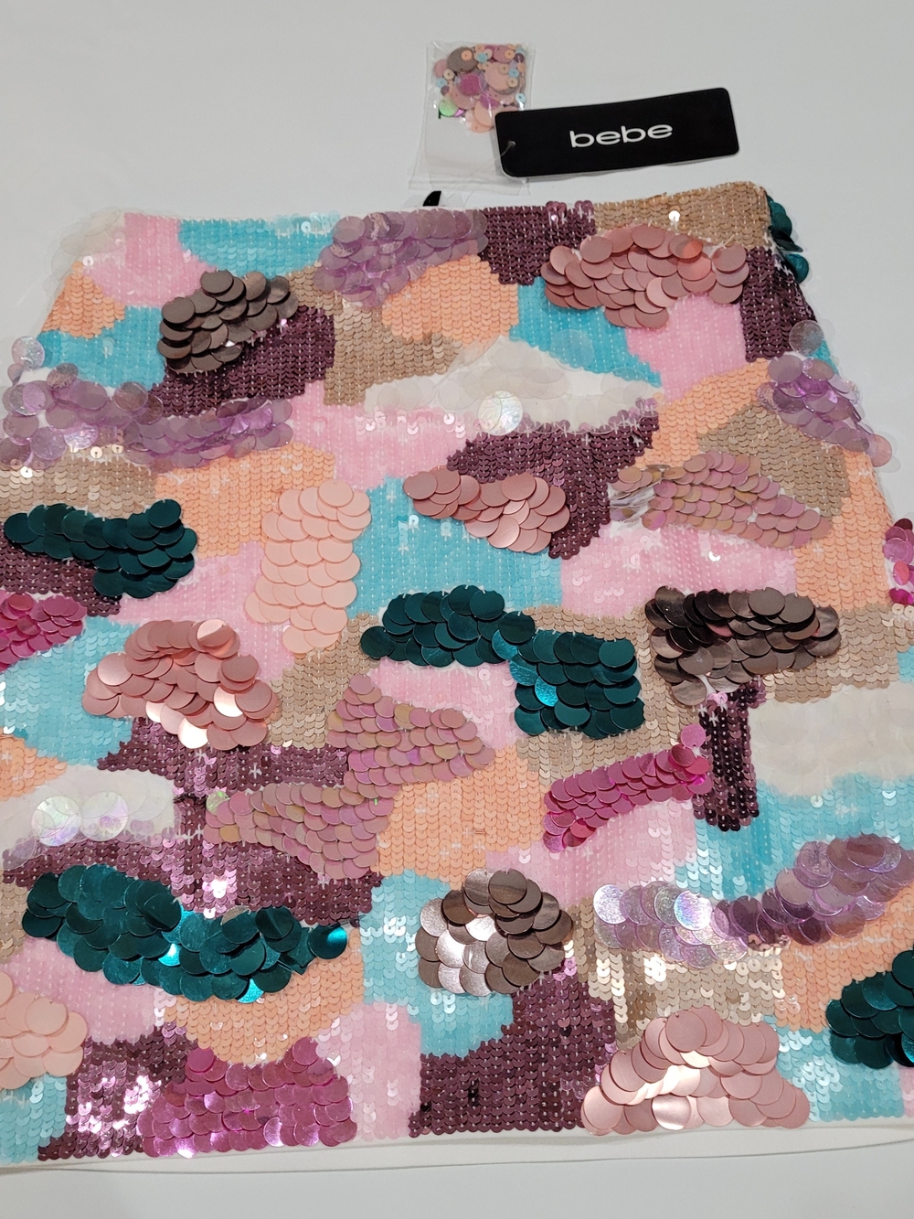 bebe Iridescent Sequin Mini Skirt in Pink, Teal, Peach, Mauve